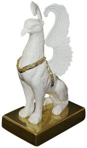 The statuette "Griffin sitting on a stone" is white and gold