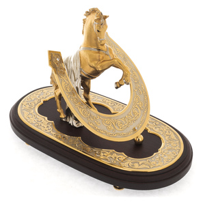 Bronze statuette "Golden horse with a horseshoe" rosewood on an oval stand