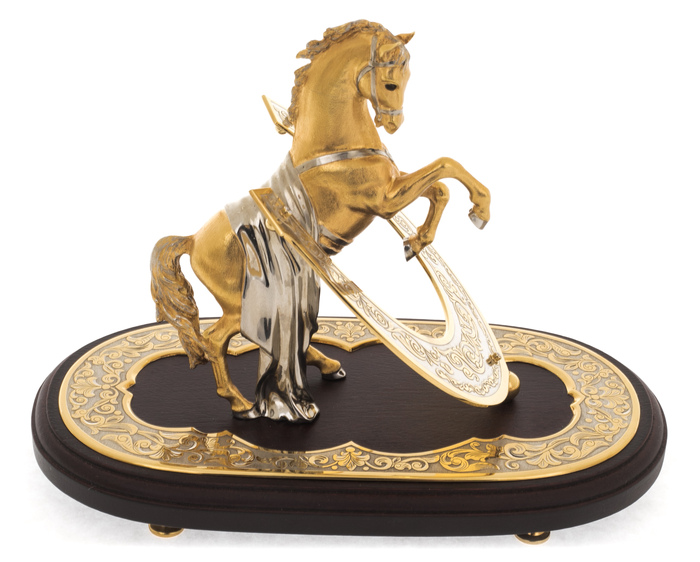 Bronze statuette "Golden horse with a horseshoe" rosewood on an oval stand