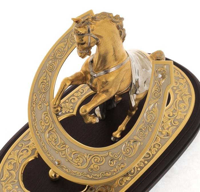 Bronze statuette "Golden horse with a horseshoe" rosewood on an oval stand