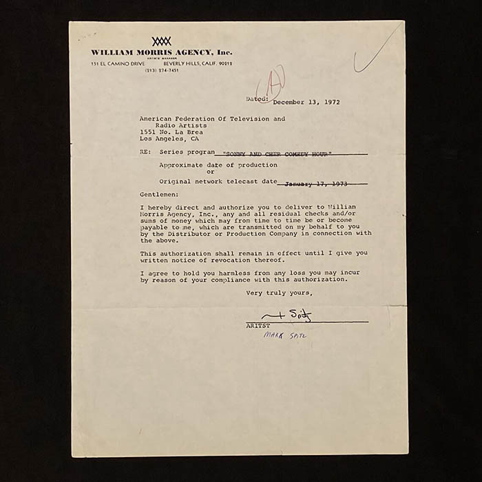 An autographed contract signed by swimmer Mark Spitz