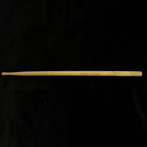 A drumstick from the personal collection of the drummer of the rock band Queen Roger Taylor