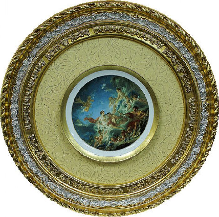 Decorative plate in a wooden frame